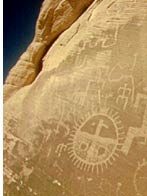 Images of geometric forms on a tan colored rock